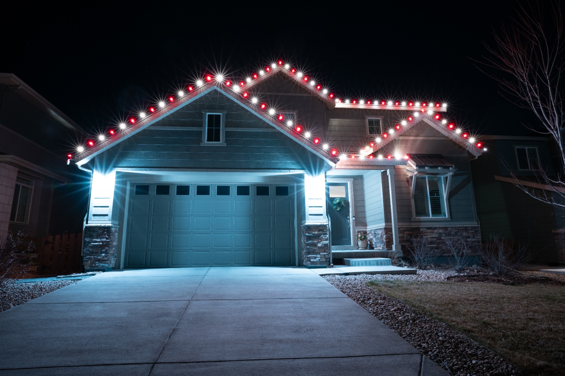 Red and white C9 Christmas lights on a craftsman home